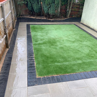 Artificial grass lawn with charcoal block edging