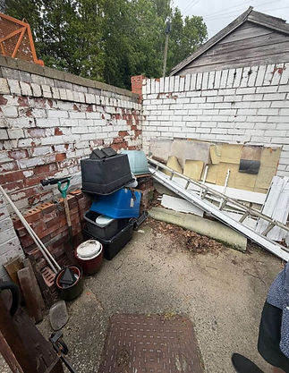 A brick wall with a single ladder leaning against it, creating a simple yet functional scene