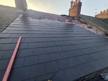 Slate roof replacement with new ridge tiles
