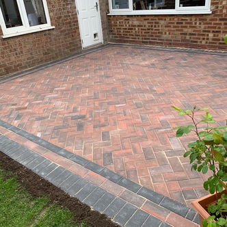 Herringbone block paved driveway with contrasting border