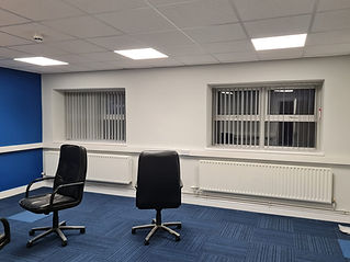 Reception area in commercial building featuring vertical blinds designed for high-traffic environment