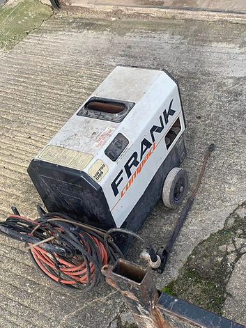 Aerial view of a white commercial van parked on a light grey surface