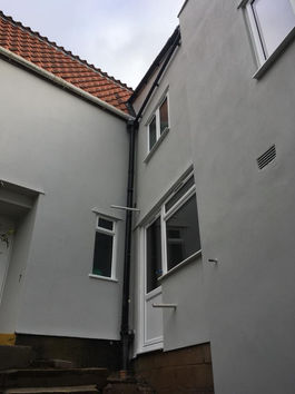 Exterior renovation of a home showing facade improvements