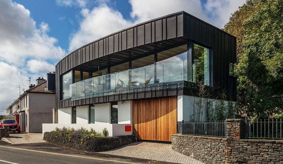 Modern building with curved black cladding and large panoramic glass windows