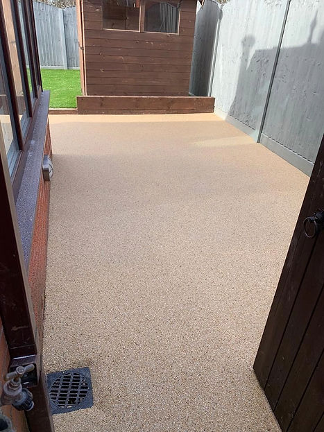 A spacious patio featuring a large expanse of concrete, ideal for outdoor gatherings and activities