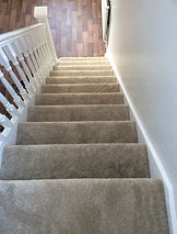 Carpeted staircase viewed from above
