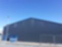 Metal building against clear sky