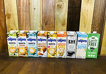 Different types of milk, including oat milk, soya milk, and almond milk