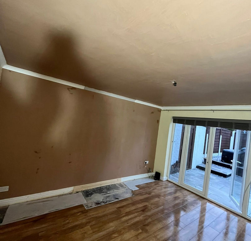 Empty room with newly plastered walls, polished wooden floor