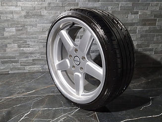 Five spoke silver alloy wheel fitted with a new black tyre tread