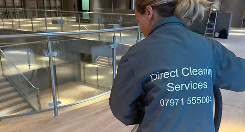 A person in a Direct Cleaning Services jacket 