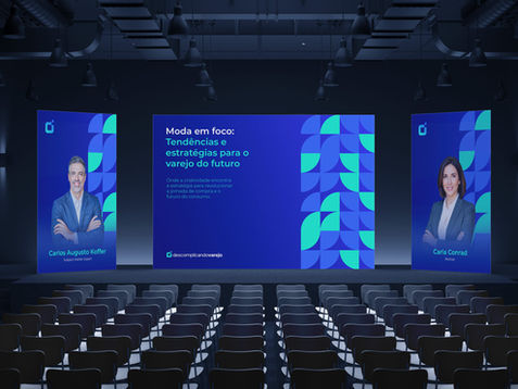 Auditório com telões exibindo apresentação Descomplicando Varejo sobre tendências do varejo