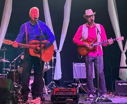 Chris rocks in the pink shirt