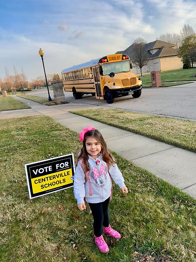 Student with school bus arriving.