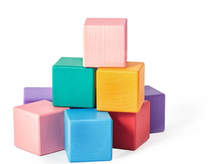 Colourful wooden toy blocks isolated on