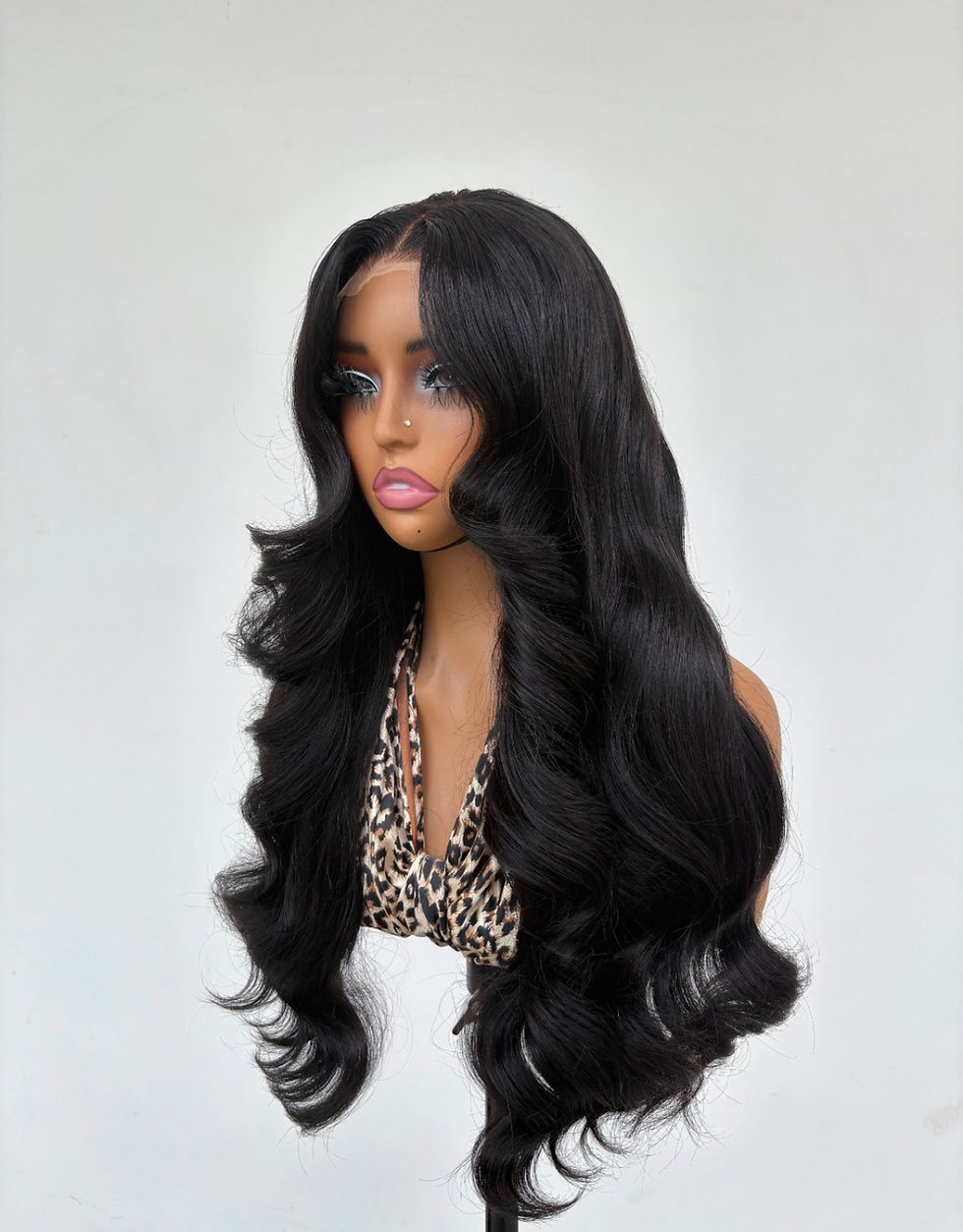 24-inch premium human hair body wave wig with soft curls and center part.