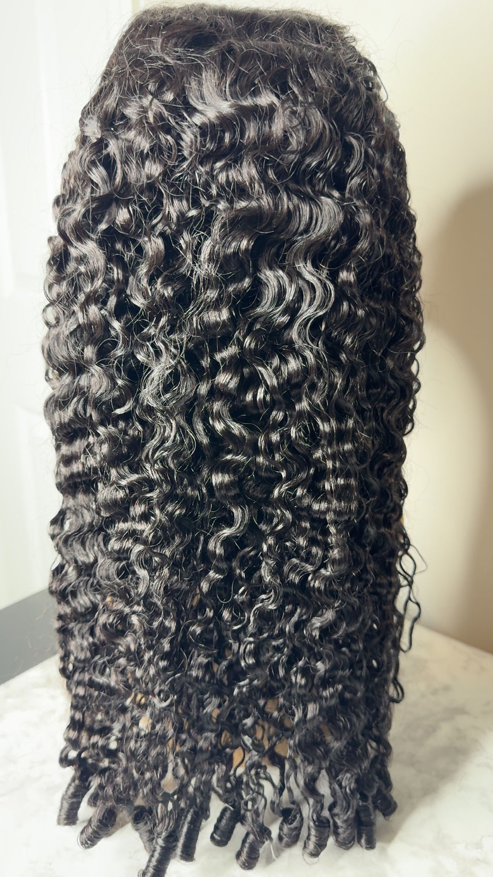 Thumbnail: Curly glueless wig with defined coils and adjustable cap for secure, no-glue wea