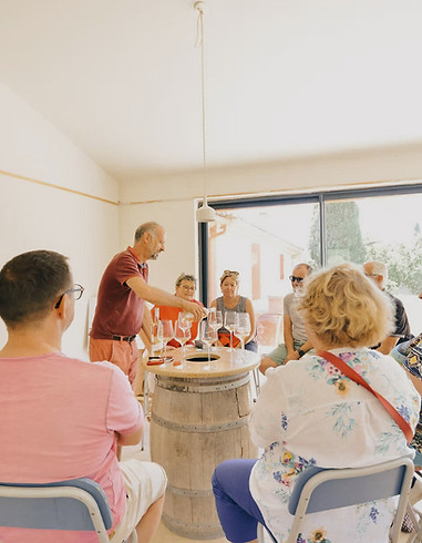 Henri hosting a wine tasting in the cellar