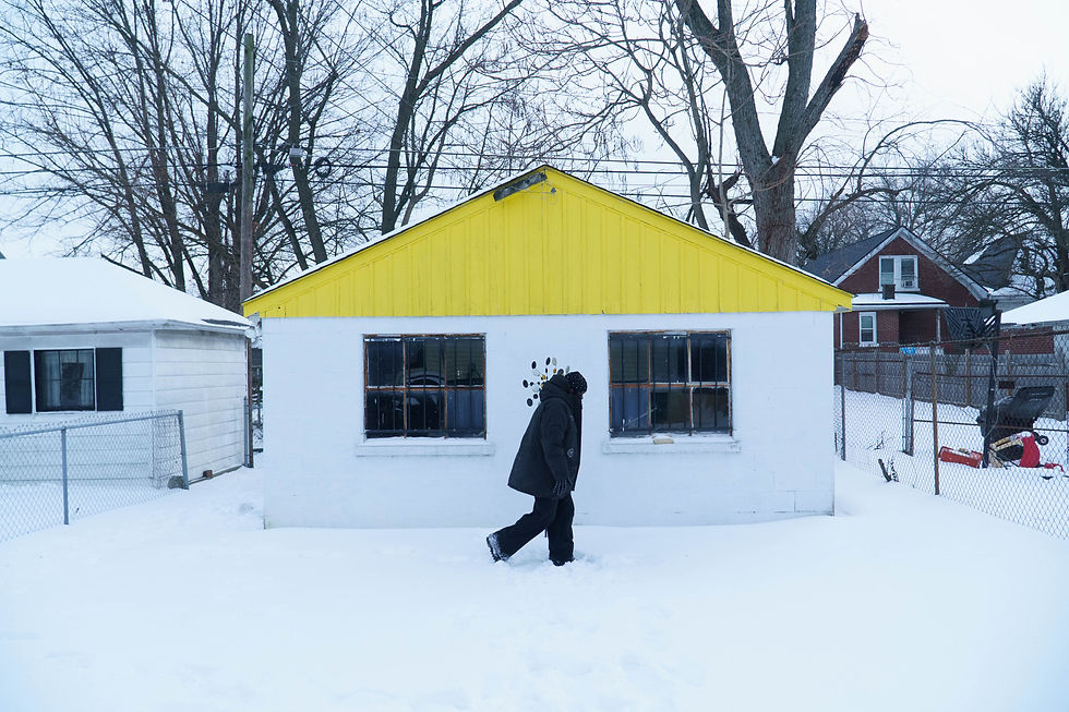 Rapper Shloob standing outdoors in the West End of Louisville, Kentucky. He is dressed in streetwear and looking directly at the camera.