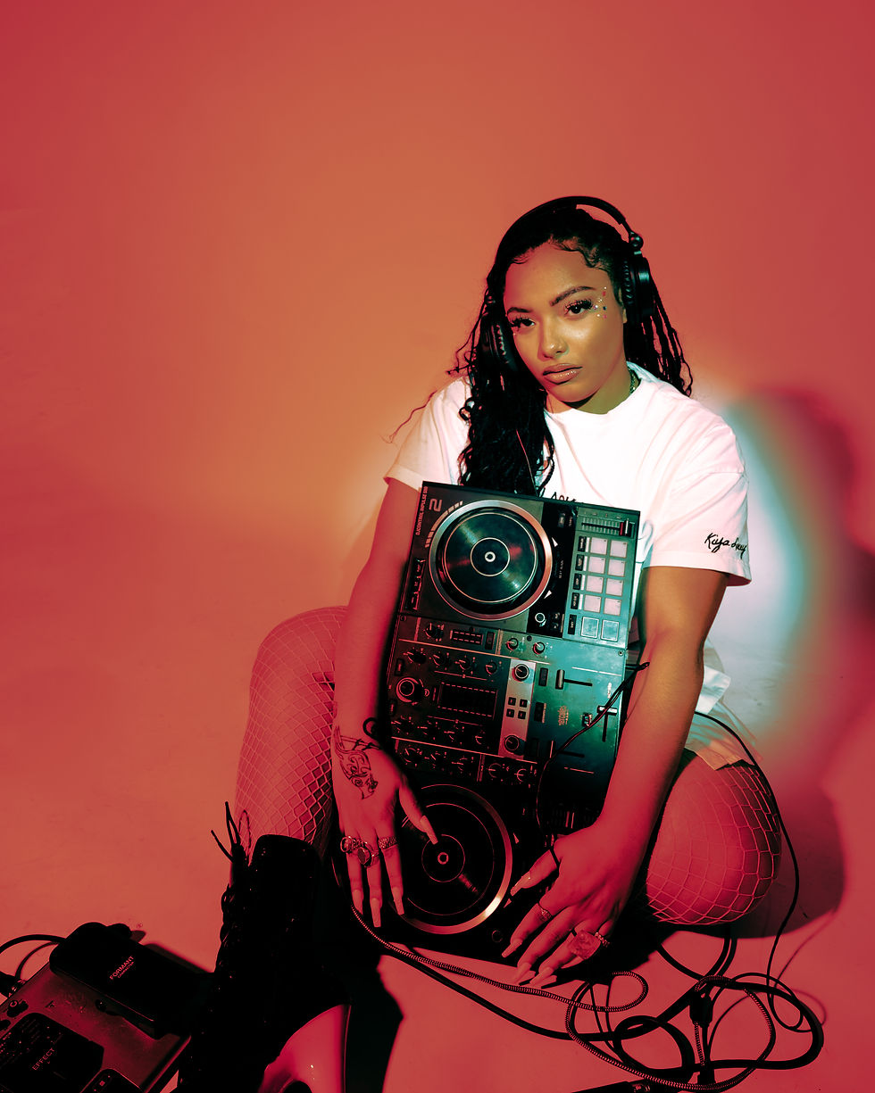 "I want everybody—from the corporate girlies to the strippers—to feel like they can get their bag. ‘Check’ is about knowing your worth and making sure they run you your money." — Kiya Lacey
The multidisciplinary artist, DJ, and founder of Fruit the Mommy opens up about her new single, her journey through music, hustle, healing, and the empire she’s building one fruit cup at a time.