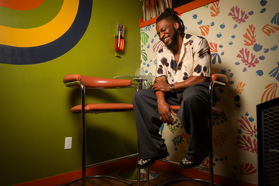 Jack Freeman, R&B singer, looking confidently at the camera with a warm smile. Promotional image for 'MVP' and 'Nina'.