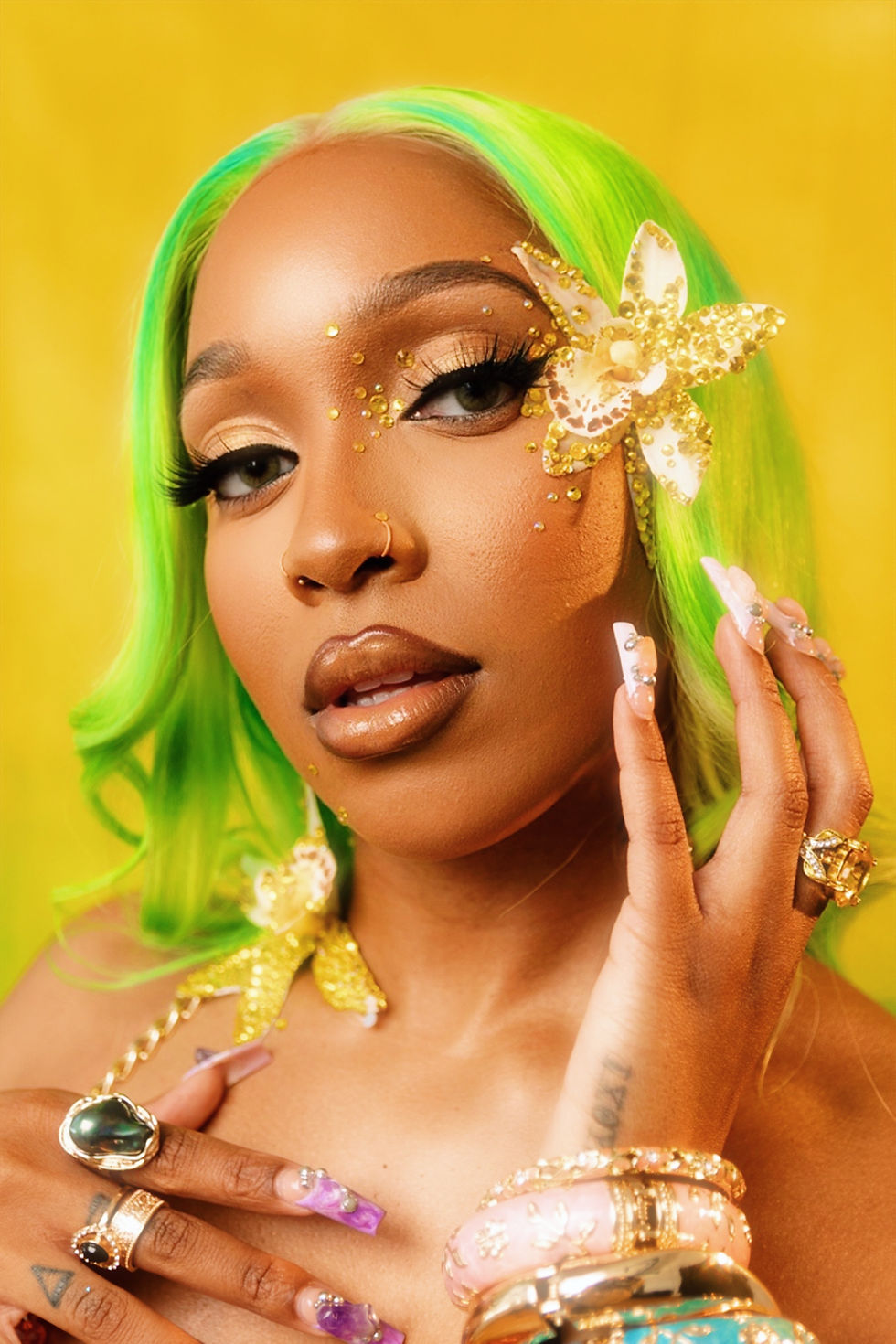 Neila, an Atlanta-based pop artist, posing in a vibrant outfit in studio.