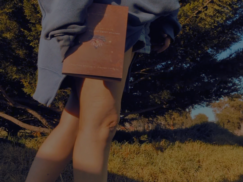 Autumn walk with a guided journal, symbolising slowing down and letting go.