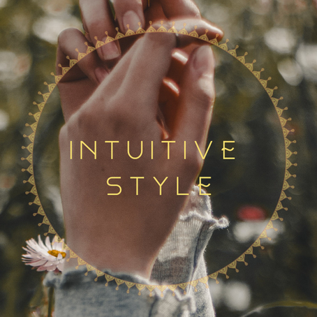 Hand gently raised in a field of soft flowers — symbolising intuitive connection, self-love, and soulful alignment through nature.