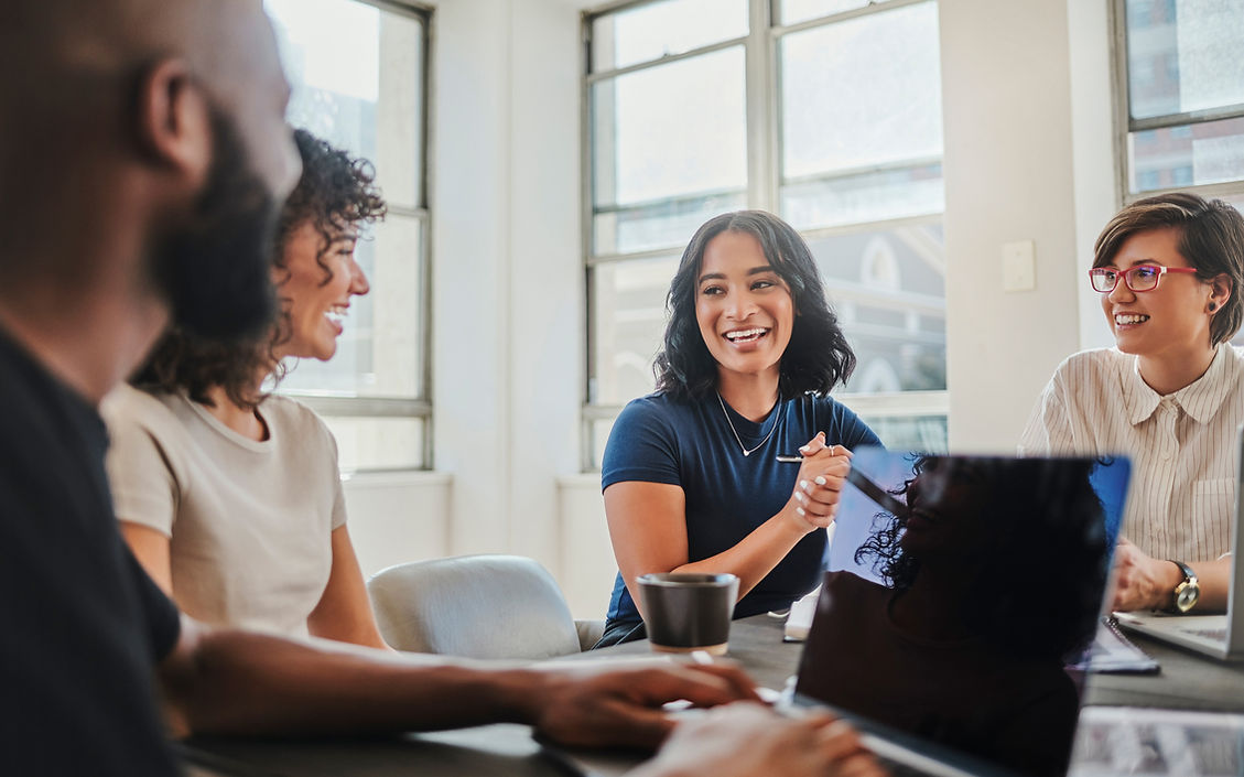 people-speaking-around-table-in-office