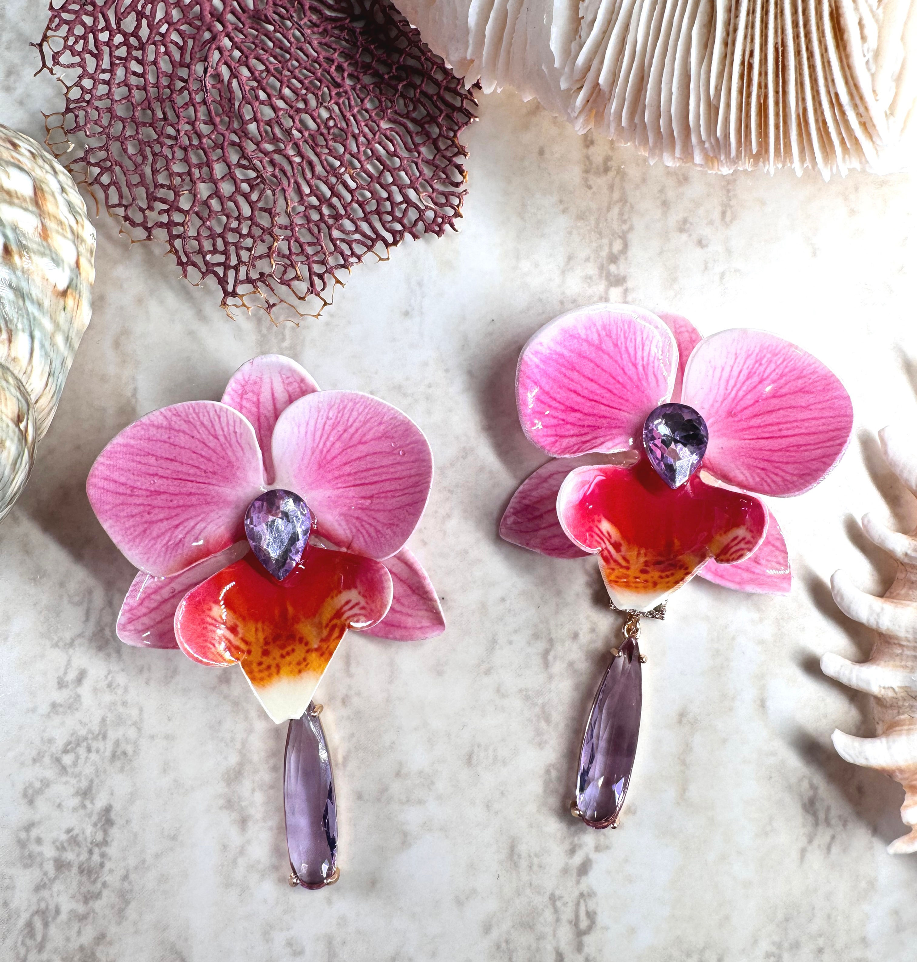 Aretes de oriquideas con cristales .