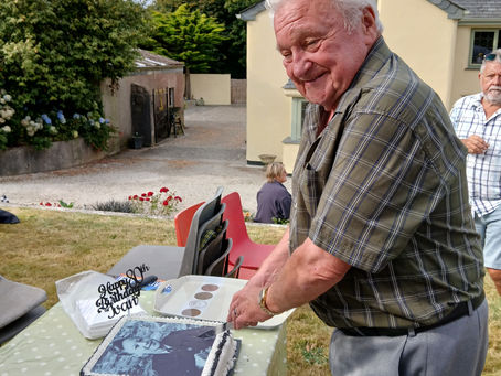Committee member Ivan cutting the cake on his 80th Birthday August 2025