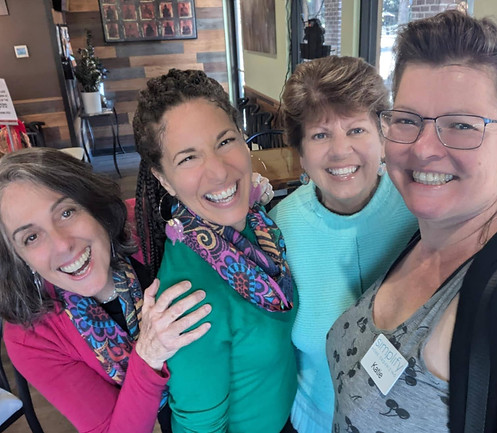 Professional home organizers Gloria, Angela, Denise, and Katie smiling