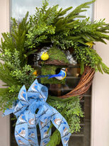 
Greenery silk arrangement in basket with decorative accents, natural artificial floral decor