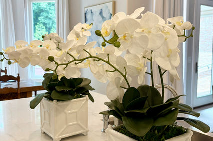 White orchid silk floral arrangement in modern planter, realistic faux flowers for home styling