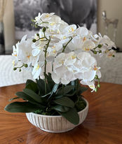 White orchid silk floral arrangement in elegant container, realistic faux flowers for home styling