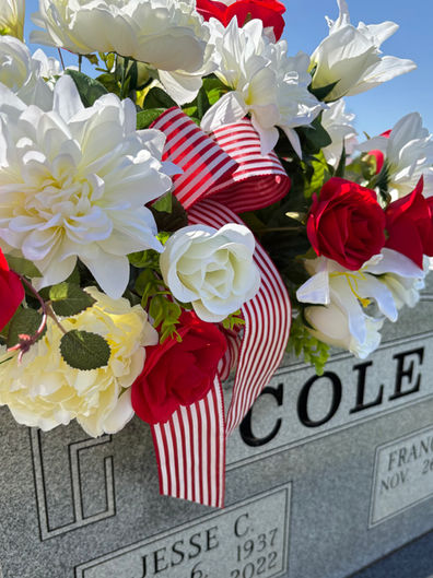 Patriotic red white and blue cemetery flower arrangement in vase for grave decoration in Fayetteville Arkansas