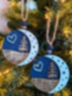 Personalized memorial ornament engraved with quote “The sky looks different when someone you love is up there,” script or pla