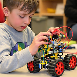 A kid working on a VEX robot.jpg