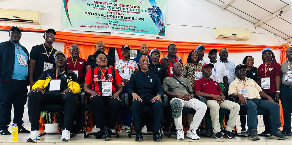 NOCZ Secretary General/CEO Boniface Kambikambi (in black attire) joins PE teachers for a group photo.