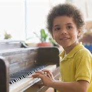 mixed boy at piano.jpeg