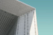 low-angle-shot-white-modern-building-blu