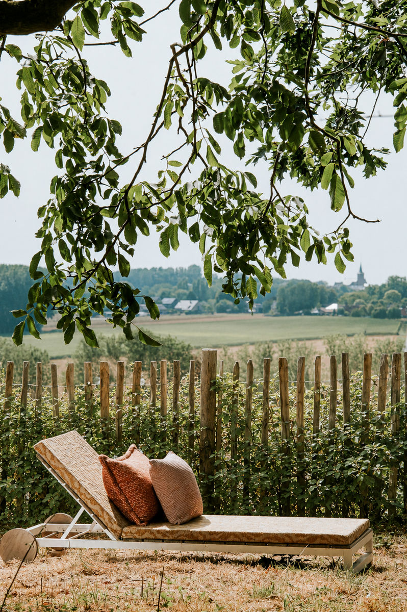Made-to-measure outdoor cushions on a lounger in the garden