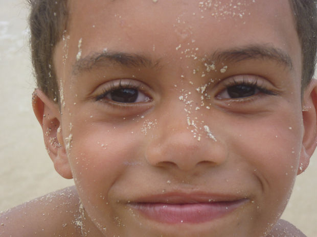 Harvey smiling - sand on face