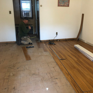 Keith installing floorings in Buddha House number 4