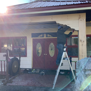 Installing the carved design on the Main Temple's Entrance