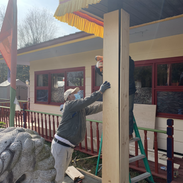 The Karmarong setting up the wooden boards for the pillars