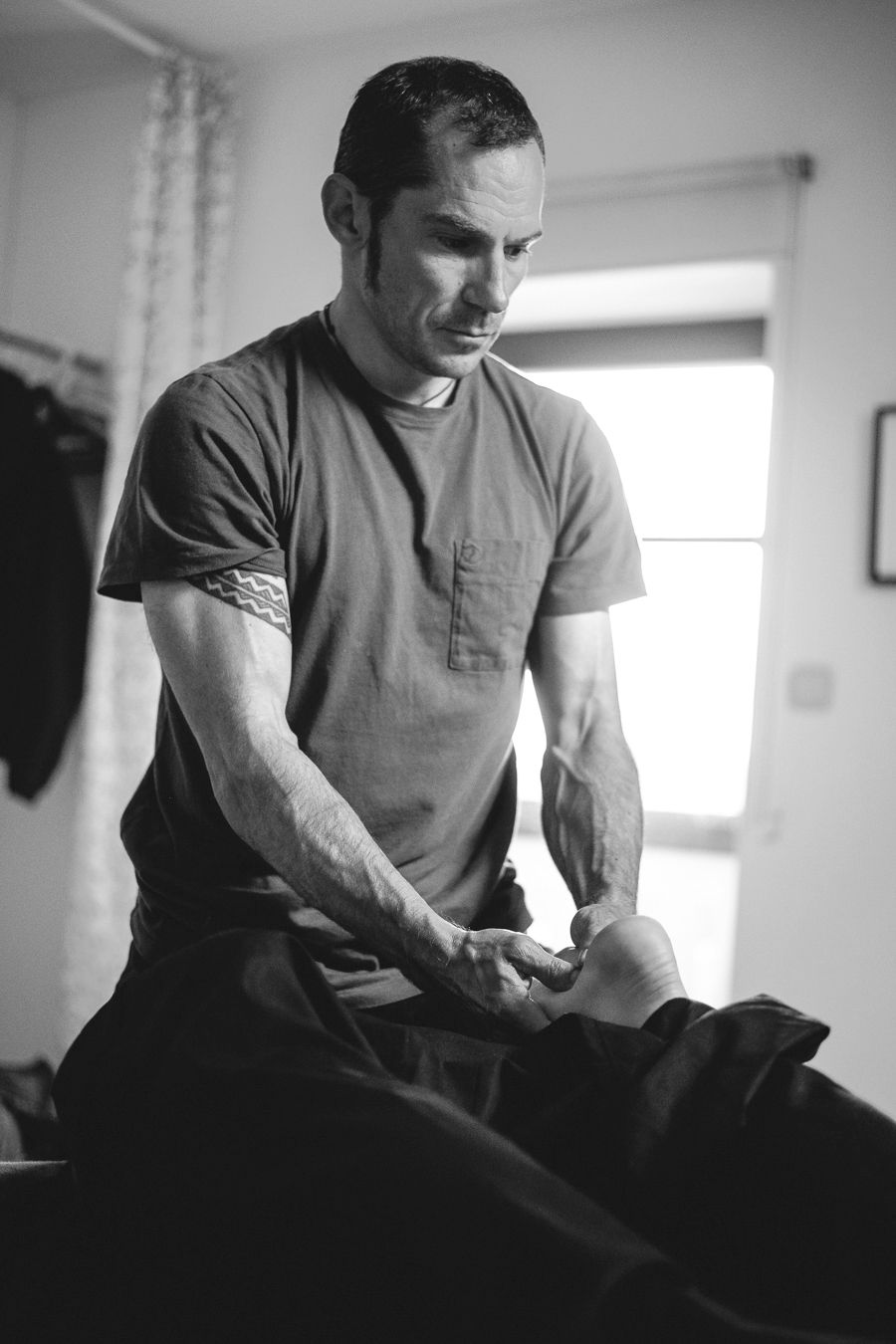 James Brickell doing deep tissue massage on leg