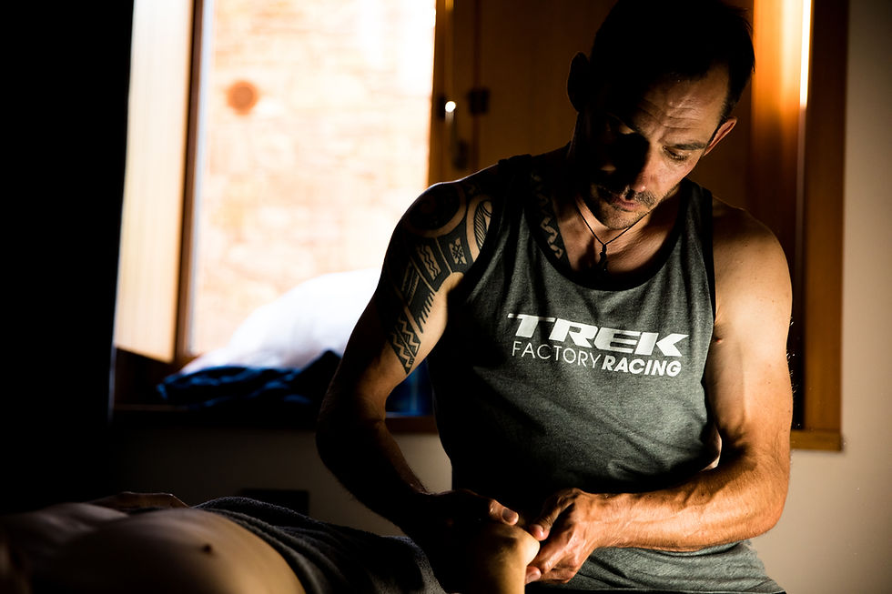 James Brickell massage therapist treating an arm