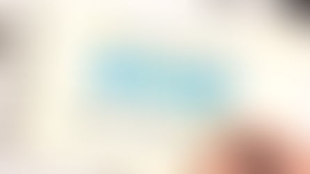 Hand writing on a notebook page with "BRAND" in blue, surrounded by terms like identity, values, strategy.