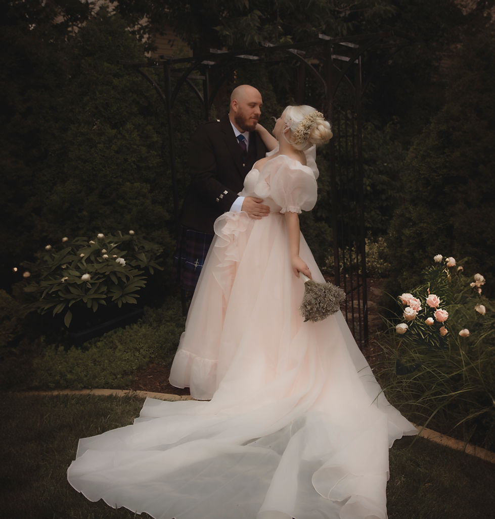 Moody bridal wedding photos in dark background pale pink selkie gown